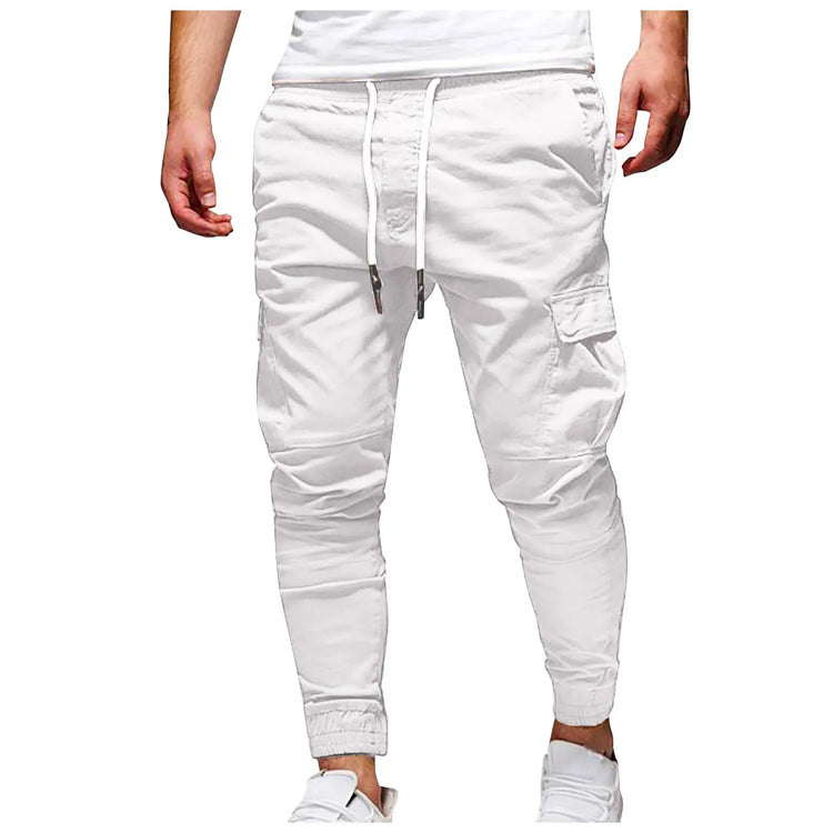 White cargo pants worn by a person on a white background