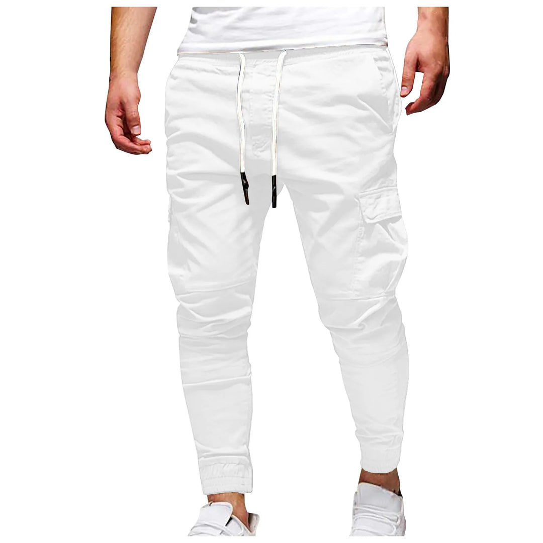 White jogger pants worn by a person on a white background