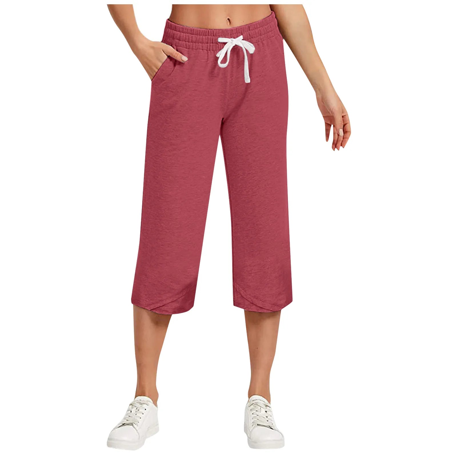 Red capri pants worn by a person on a white background