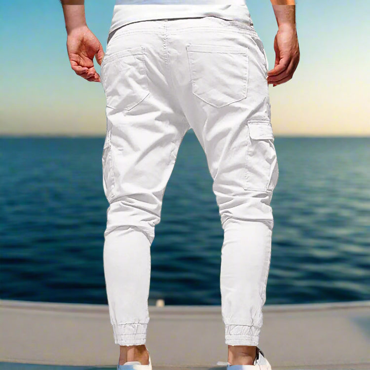 White cargo jogger pants on a white background