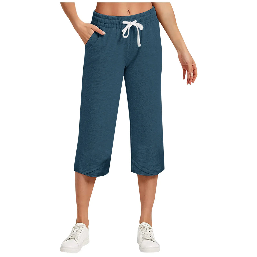 Blue capri pants with a drawstring waist on a white background