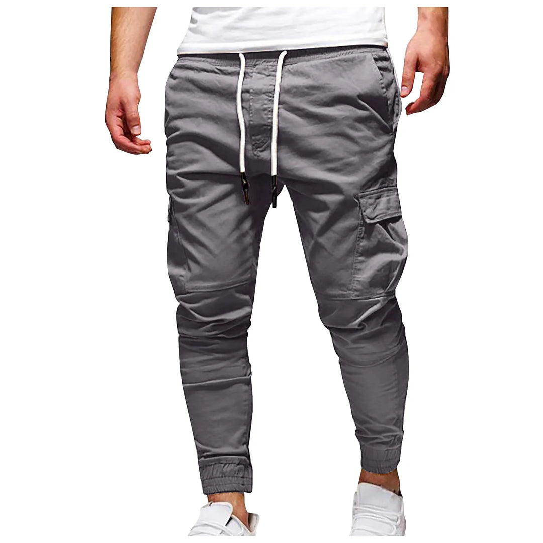 Gray jogger pants with a white drawstring on a white background