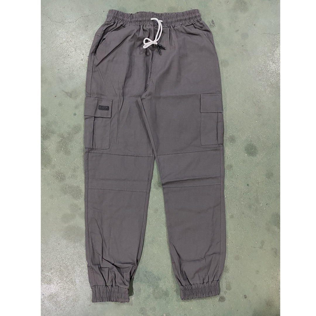 Gray cargo pants on a textured surface