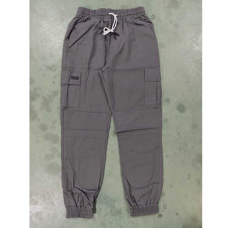 Gray cargo pants on a textured surface