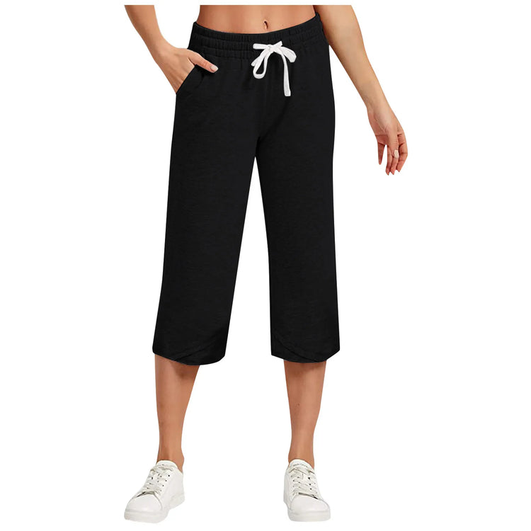 Black capri pants with a white drawstring on a white background