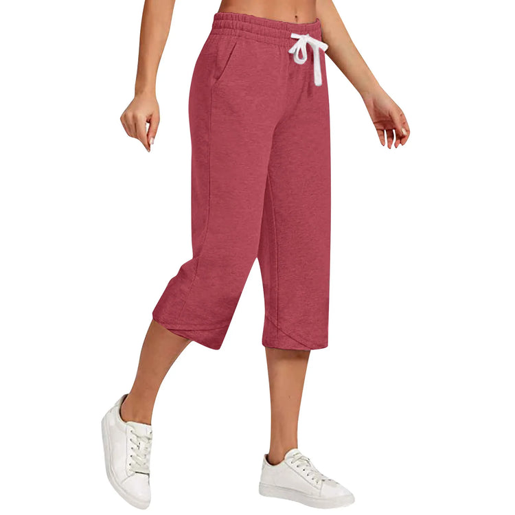 Red capri pants with a white drawstring on a white background