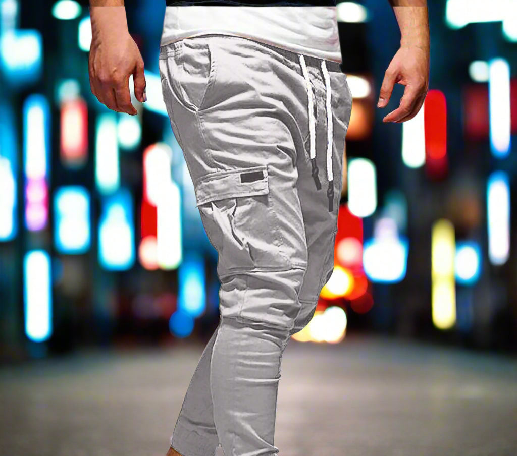 Gray cargo jogger pants worn by a person on a white background