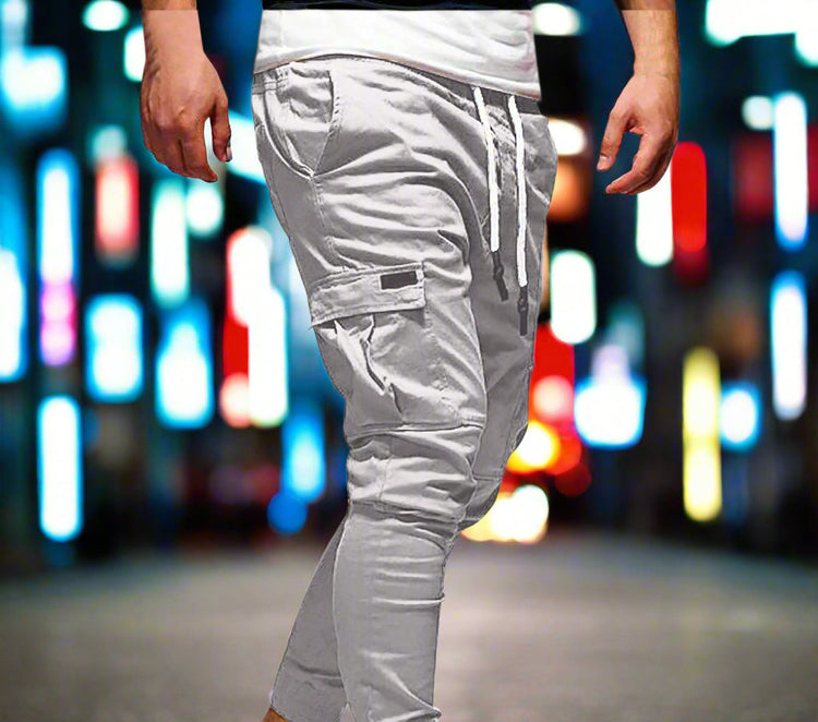 Gray cargo jogger pants worn by a person on a white background