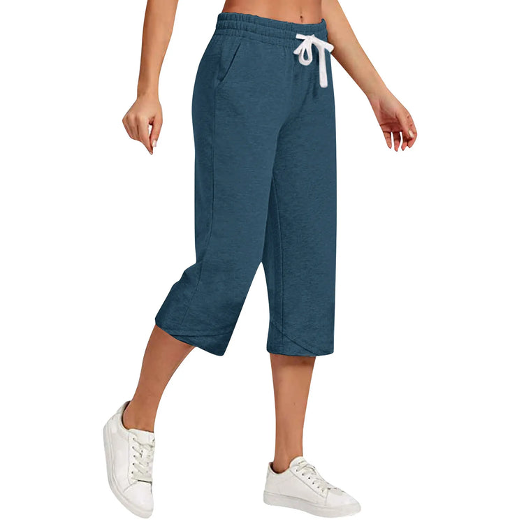 Blue capri pants with a drawstring on a white background