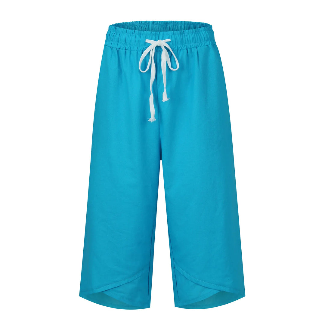 Turquoise pants with a drawstring on a white background