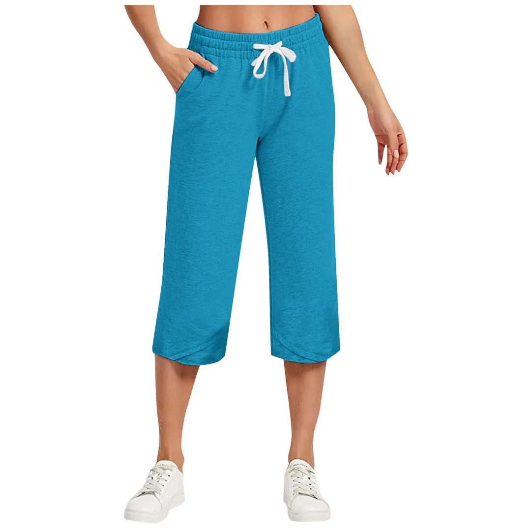 Blue capri pants with a white drawstring on a white background