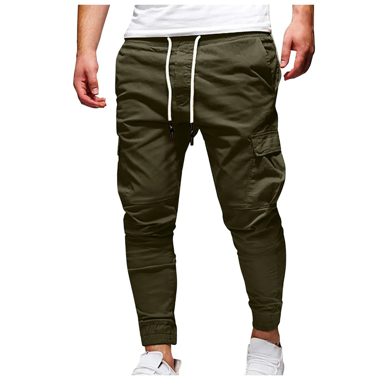 Green jogger pants with a white drawstring on a white background